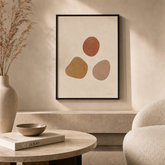 Three Warm Stones Poster — Three hand-drawn stones in terracotta ochre and warm clay, lifestyle in interior, Atelier Poster