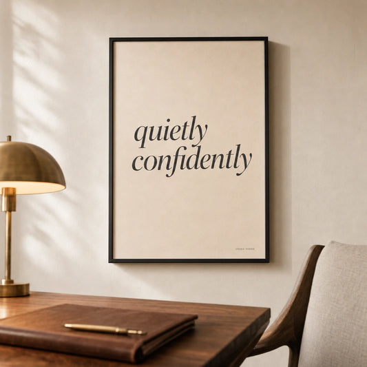 Quietly Confidently Poster — Stacked 'quietly confidently' italic charcoal restraint, lifestyle in interior, Atelier Poster