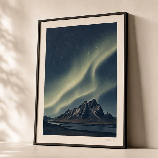 Iceland Northern Lights Poster — Iceland aurora borealis over dark mountain silhouettes, premium hero shot, Atelier Poster