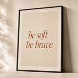 Be Soft Be Brave Poster — Two-line 'be soft be brave' italic terracotta feminine wisdom, premium hero shot, Atelier Poster