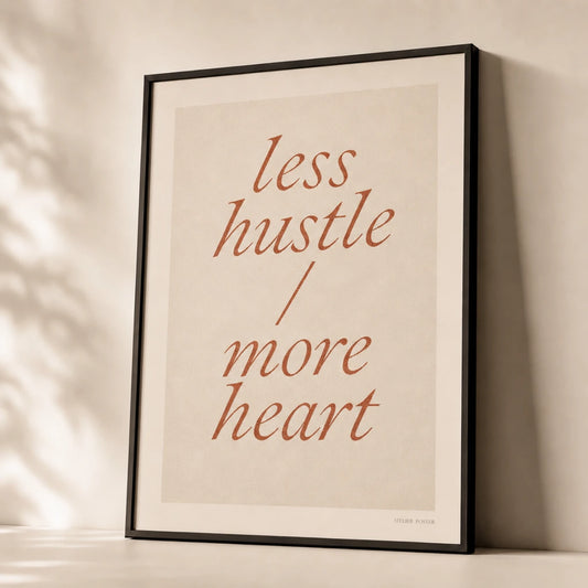Less Hustle More Heart Poster — Two-line 'less hustle more heart' italic terracotta, premium hero shot, Atelier Poster