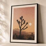Joshua Tree Desert Poster — Joshua Tree silhouettes against pink-ochre desert sunset, premium hero shot, Atelier Poster
