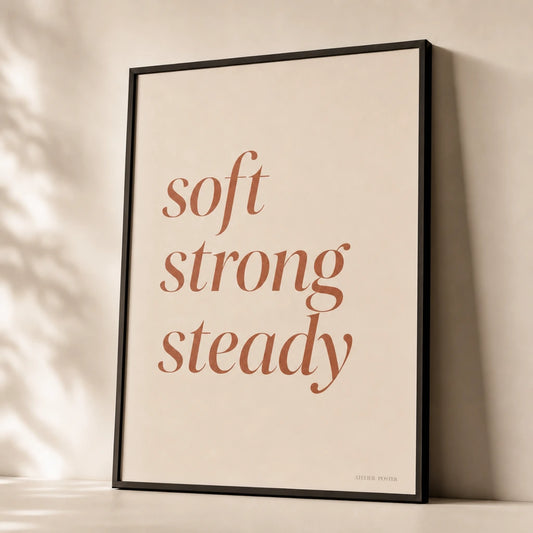 Soft Strong Steady Poster — Stacked 'soft strong steady' italic terracotta feminine, premium hero shot, Atelier Poster