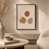 Three Warm Stones Poster — Three hand-drawn stones in terracotta ochre and warm clay, lifestyle in interior, Atelier Poster