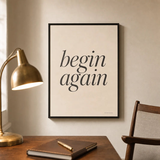Begin Again Quiet Poster — Two-word quiet mantra 'begin again' in elegant serif italic, lifestyle in interior, Atelier Poster