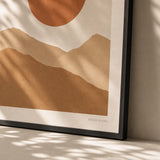 Terracotta Sun Mountains Poster — Terracotta sun behind ochre desert mountains warm earth tones, close-up detail of print, Atelier Poster