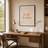 Be Soft Be Brave Poster — Two-line 'be soft be brave' italic terracotta feminine wisdom, wide room display, Atelier Poster