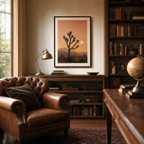 Joshua Tree Desert Poster — Joshua Tree silhouettes against pink-ochre desert sunset, wide room display, Atelier Poster