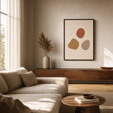 Three Warm Stones Poster — Three hand-drawn stones in terracotta ochre and warm clay, wide room display, Atelier Poster
